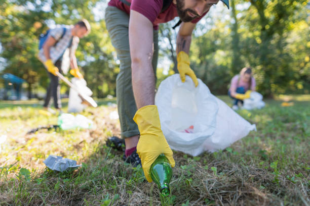 istock Young people cleaning the park 1153404128