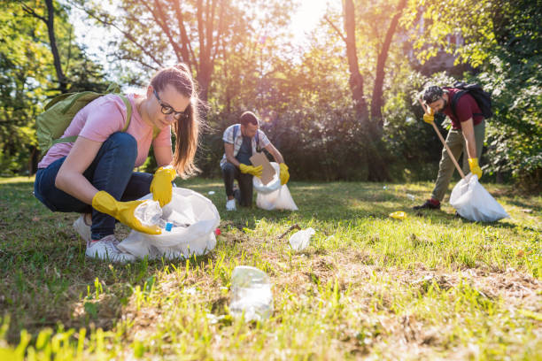 istock Group of people collecting garbage in the park 1153404163