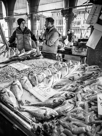 Venice, Italy, Feb 26 - The fish market in Venice, near the Rialto Bridge, is one of the most interesting areas of the city on the water, visited by few tourists but able to offer very suggestive and original glimpses of real daily life. The hidden Venice, far from the traditional tourist routes, allows you to discover the most suggestive and least known corners of the city on the water, destination of millions of tourists every year.