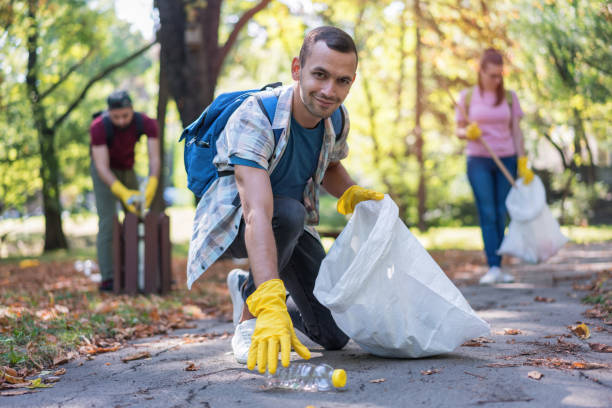 istock Responsible young man cleaning the park 1153405261