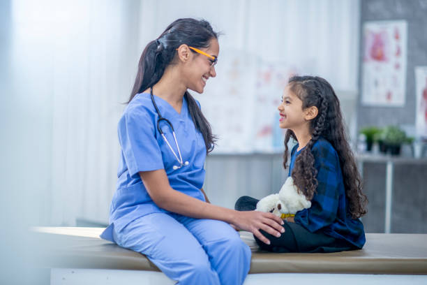 istock Girl at doctor's office 1153407864
