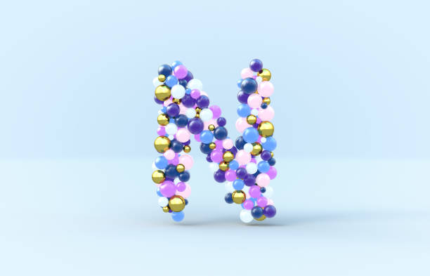 istock Sweet candy balls letter N. 3D render glossy font on isolated background. 1153408038