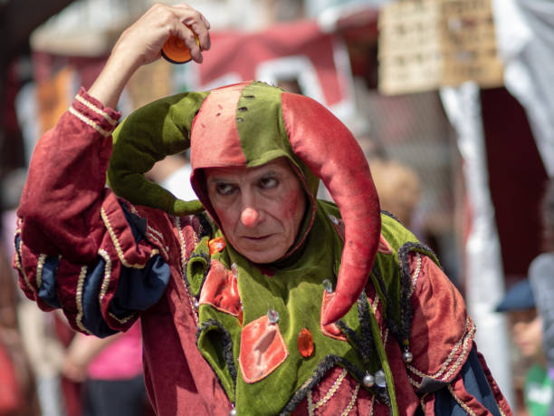 May 01, 2019 City of El Alamo, Guadalajara, Spain, Medieval market May 01, 2019 City of El Alamo, Guadalajara, Spain, Medieval market. The inhabitants of the City of El Alamo disguise themselves and perform in the streets during the festivity of the medieval market of the city. troubadour stock pictures, royalty-free photos & images