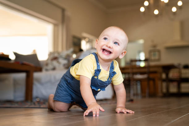 istock Little cute baby crawling at home 1153409244