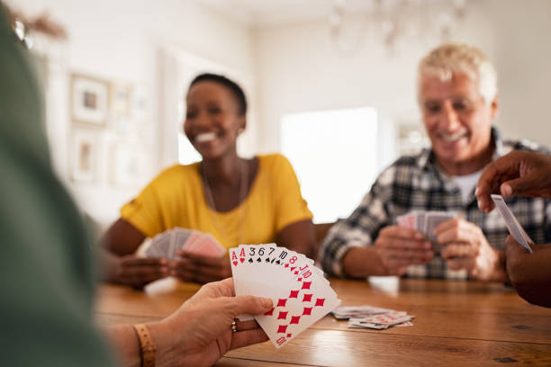 istock Closeup of hand holding playing cards 1153409396