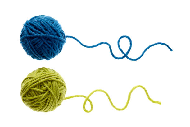 istock Blue and green woolen balls over white background. 1153409971