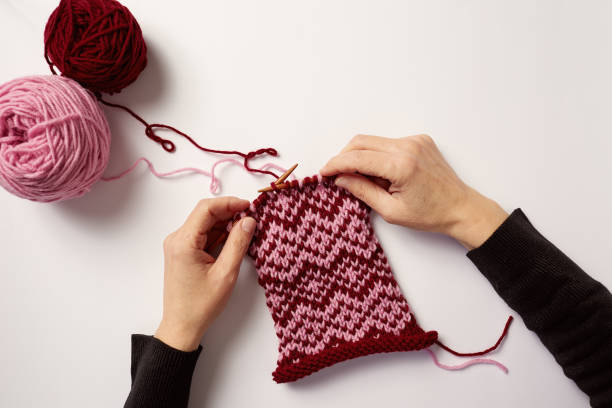 istock Woman hands knitting with needles and yarn 1153410001