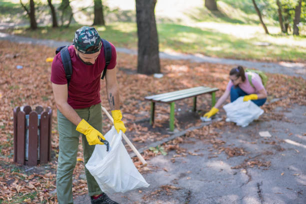 istock Intelligent young people cleaning the local park 1153412502