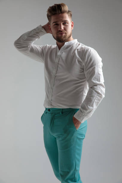 istock Motivated young man standing and posing relaxed 1153415125