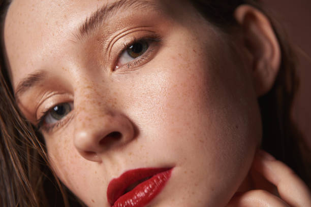 istock Close up young female with bright color lipstick 1153415454