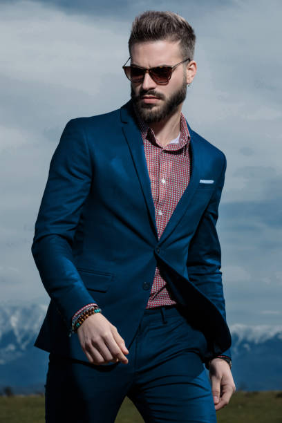 istock Tough man walking forward and looking to the side 1153417076