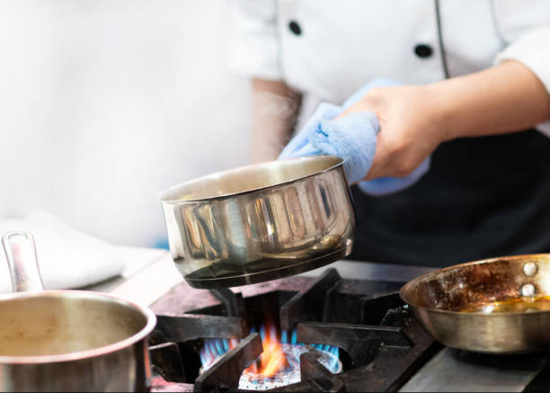 istock Chef preparing food, meal, in the kitchen, chef cooking 1153419623