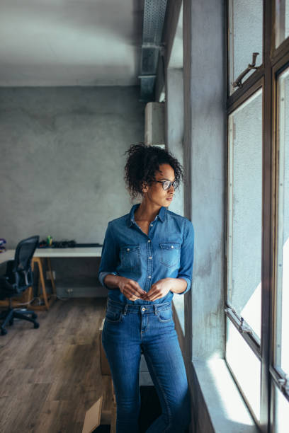 istock Small business owner looking outside the window 1153419830