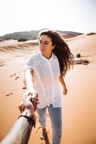 istock walking together into the desert 1153424001