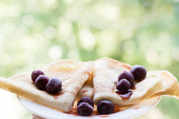 pancakes with cherry and jam . food background , copy space