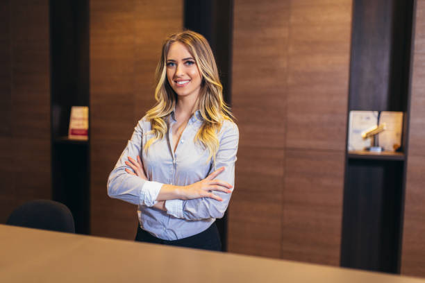 Picture of pretty receptionist at work Picture of pretty receptionist at work concierge photos stock pictures, royalty-free photos & images