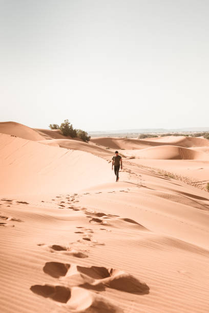 istock man walking in the desert 1153424184