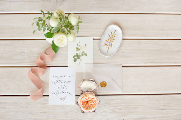 istock Wedding invitation card with decorations on wood background. Rustic Wedding Overhead view. Flat lay, top view wedding invitation card Templates. 1153424386