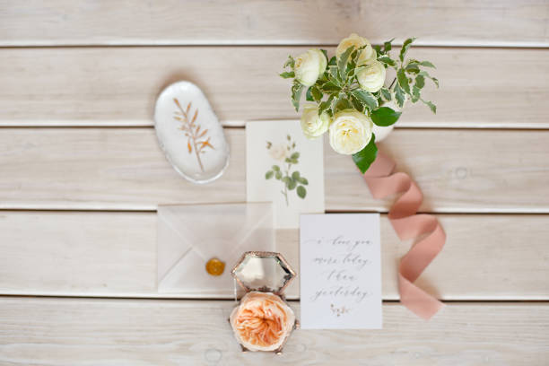 istock Wedding invitation card with decorations on wood background. Rustic Wedding Overhead view. Flat lay, top view wedding invitation card Templates. 1153424401