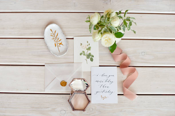 istock Wedding invitation card with decorations on wood background. Rustic Wedding Overhead view. Flat lay, top view wedding invitation card Templates. 1153424406