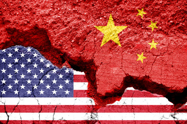 Flag of USA and China on a cracked background. Concept of crisis between two nations, Washington and Beijing Flag of USA and China on a cracked background. Concept of crisis between two nations, Washington and Beijing cold war photos stock pictures, royalty-free photos & images