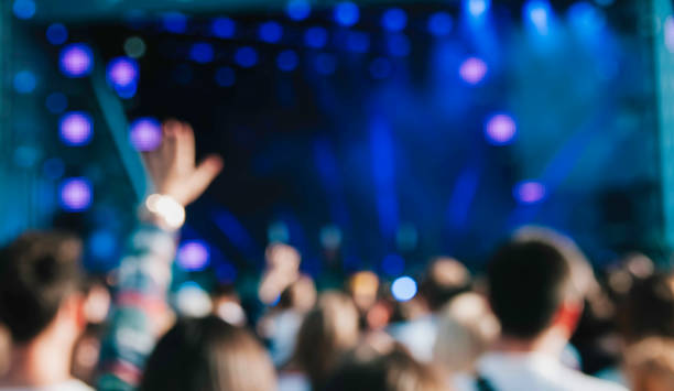 istock Crowd at concert. Blurred and defocused 1153425678