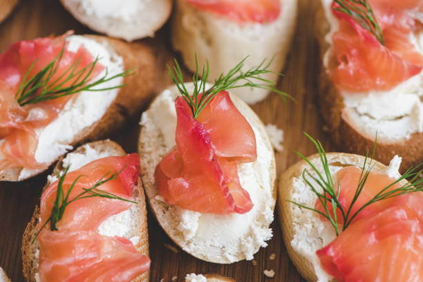 istock Smoked salmon bite sandwich with dill and cream cheese. 1153425858
