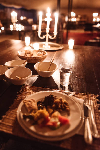 istock eating at candle light in a tent 1153426075