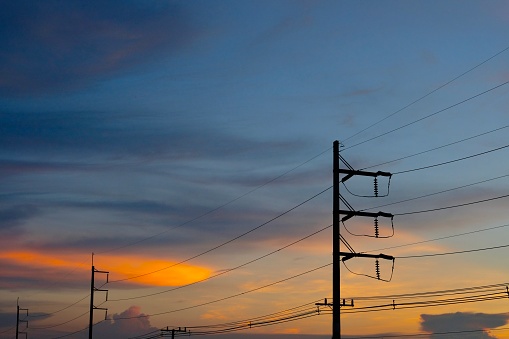 Electric towers against beautiful sky