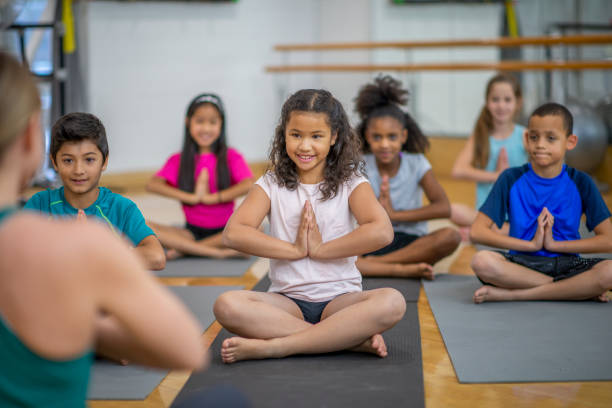 istock Group of kids in gym class at school 1153427820