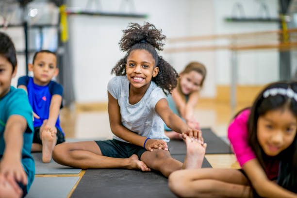 istock Group of kids in gym class at school 1153427845