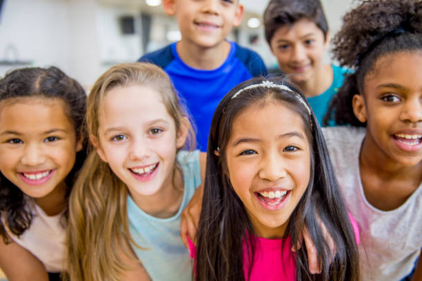 istock Group of kids in gym class at school 1153427846