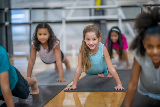 istock Group of kids in gym class at school 1153427849