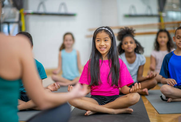 istock Group of kids in gym class at school 1153427852