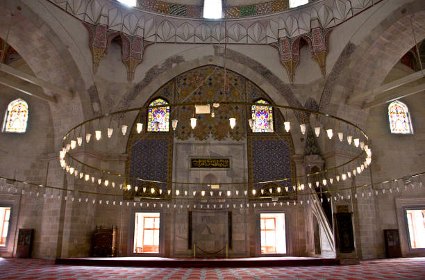 Edirne three Şerefeli Mosque, Uc Serefeli Mosque Edirne, Turkey - April 19, 2019: People pray in mosque called 3 şerefeli cami (Uc Serefeli mosque) Mosque in the center of city of Edirne, East Thrace, Turkey. The Üç Serefeli Mosque, named after its unusual minaret with three balconies (serefe), was built between 1438. unesco organised group stock pictures, royalty-free photos & images