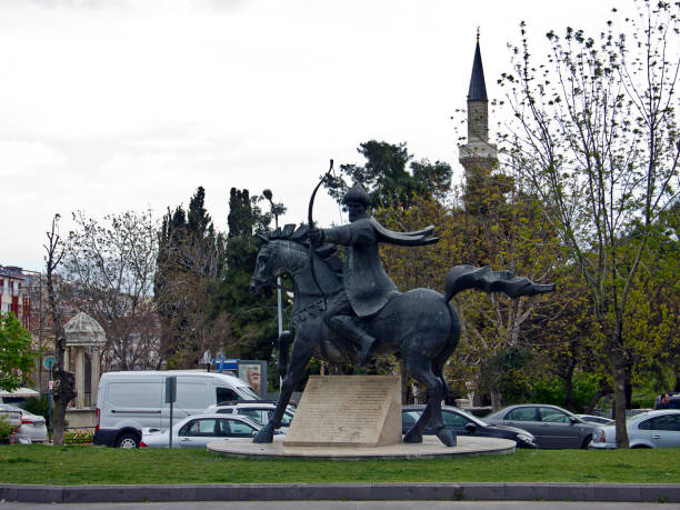 Monument to Minin and Pozharsky (1816)  is a bronze statue on Red Square in Moscow, Russia, in front of Saint Basils Cathedral. Black and white photo.
