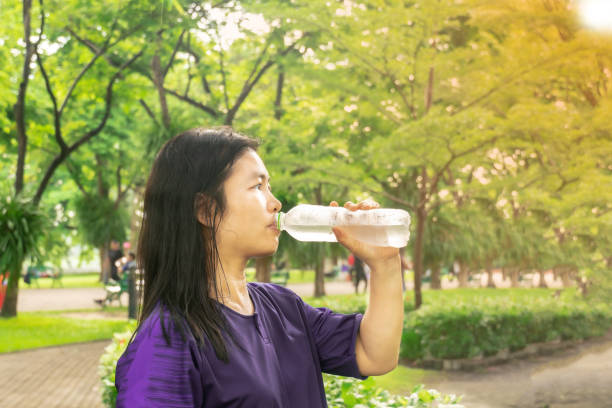 istock Asian women are drinking water from bottles 1153429028