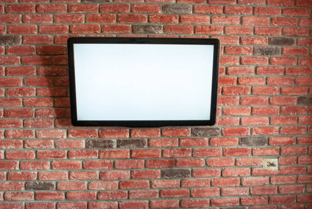 istock On the red interior brick wall is a white screen TV 1153429388