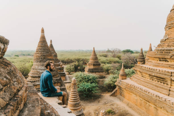 istock Man looking at scenic  view of Bagan Heritage Site from above 1153430304