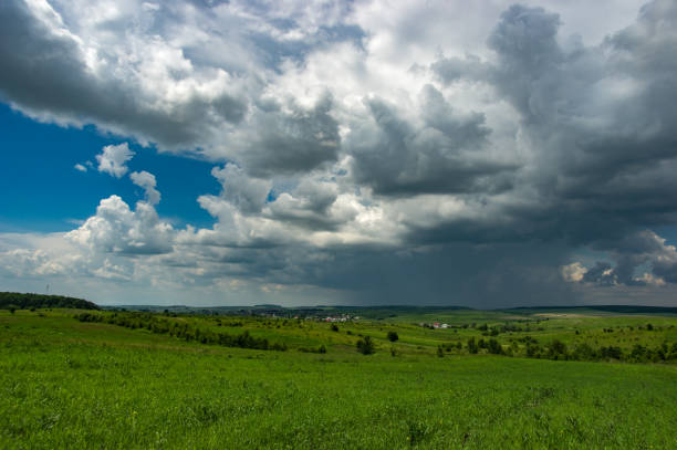 istock Summer thunderstorm over the village 1153430862