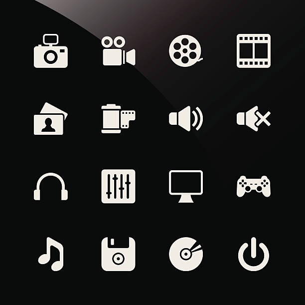 Multimedia Web Icons A set of multimedia web icons that include a camera (dslr), camcorder (video camera), a roll of film, film, picture (photo), speaker on and off, microphone (earphone), audio tuning adjuster, computer (monitor), a gaming pad, music, diskette, cd (storage), and a power symbol. vcr photos stock illustrations