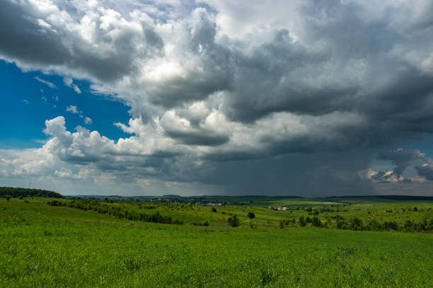 istock Summer thunderstorm over the village 1153430941