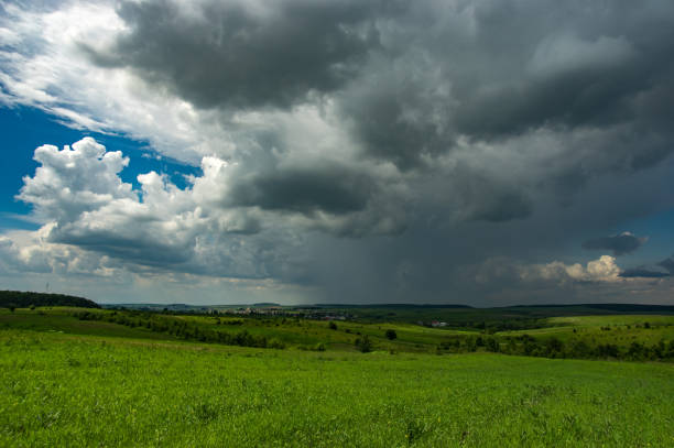 istock Summer thunderstorm over the village 1153431766