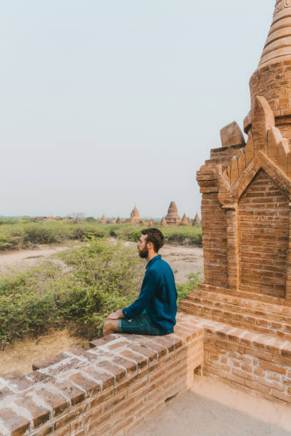 istock Man looking at scenic  view of Bagan Heritage Site from above 1153431913