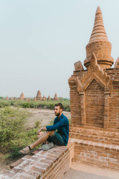 istock Man looking at scenic  view of Bagan Heritage Site from above 1153432553