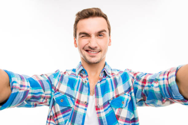 istock Handsome man making selfie photo 1153435049
