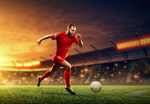 istock Soccer player dribbles a ball 1153435450