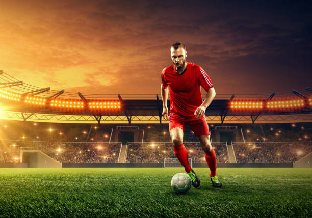 istock Soccer player dribbles a ball 1153435454