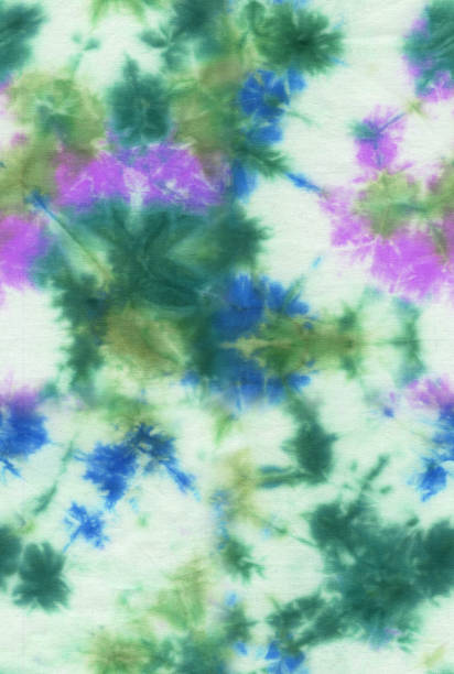 istock Abstract seamless tie-dye hand painted fabric background with irregular floral spots 1153435467