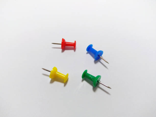 istock Set of colored push pin on white background 1153436566